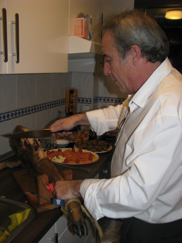 My friend, Antonio, carving the Iberian ham--a meat Andres's family have on their Christmas table.
